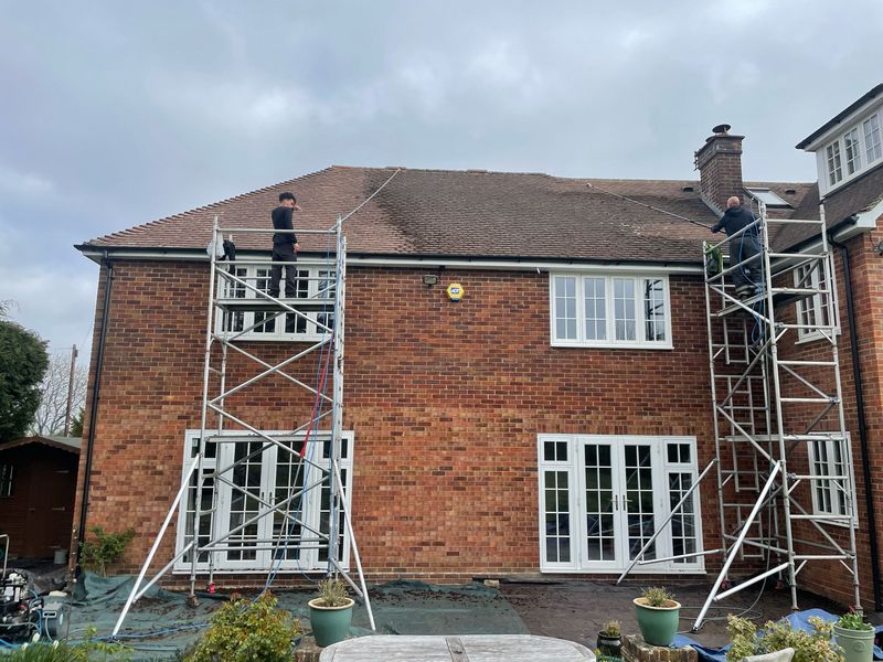 Roof cleaning carried out safely from scaffold towers by The Roof Moss Cleaners in Atherstone